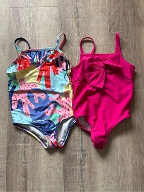 Pair of Carter’s swimsuits